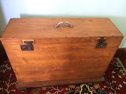 The portable harmonium in its traveling case